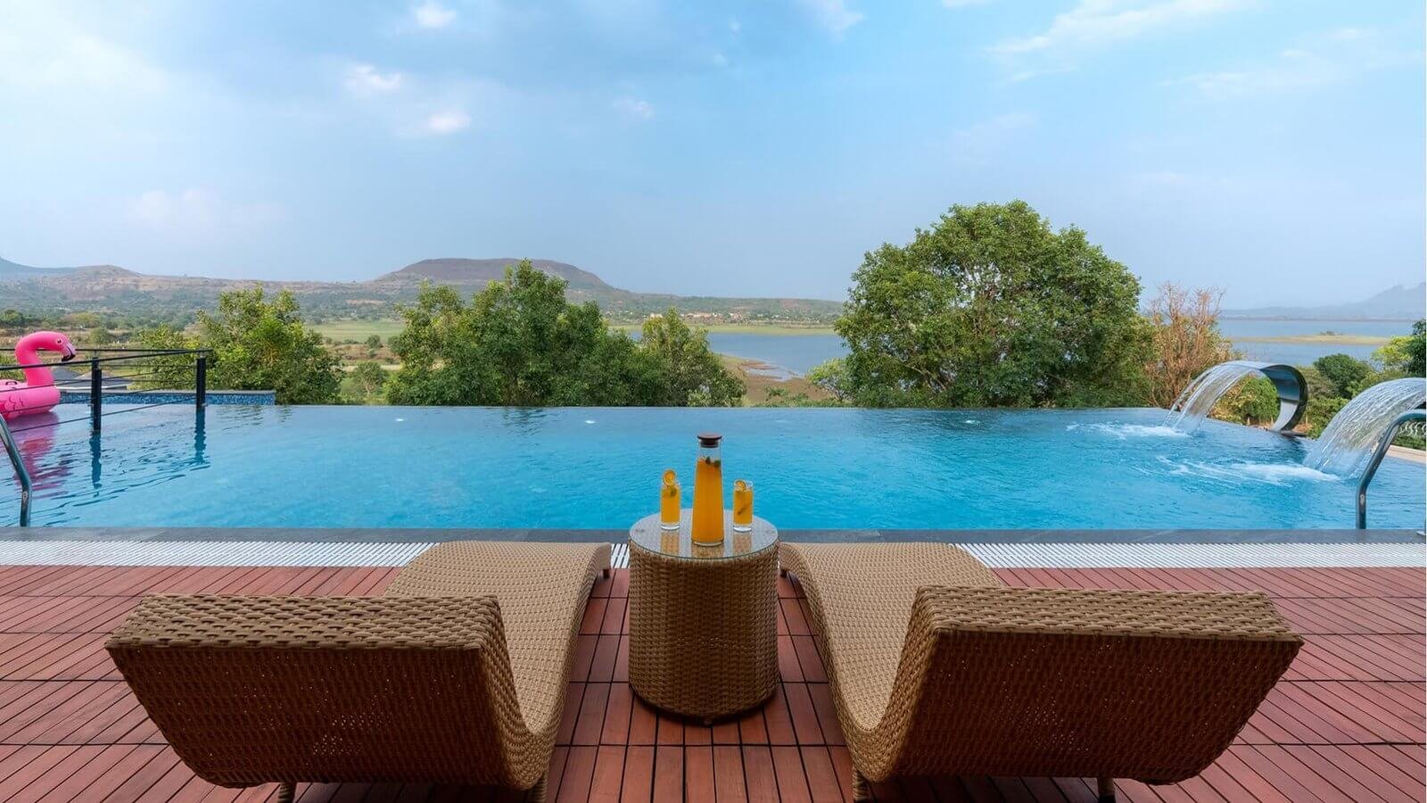 POOL DETAIL – Infinity edge, hills reflected on water.